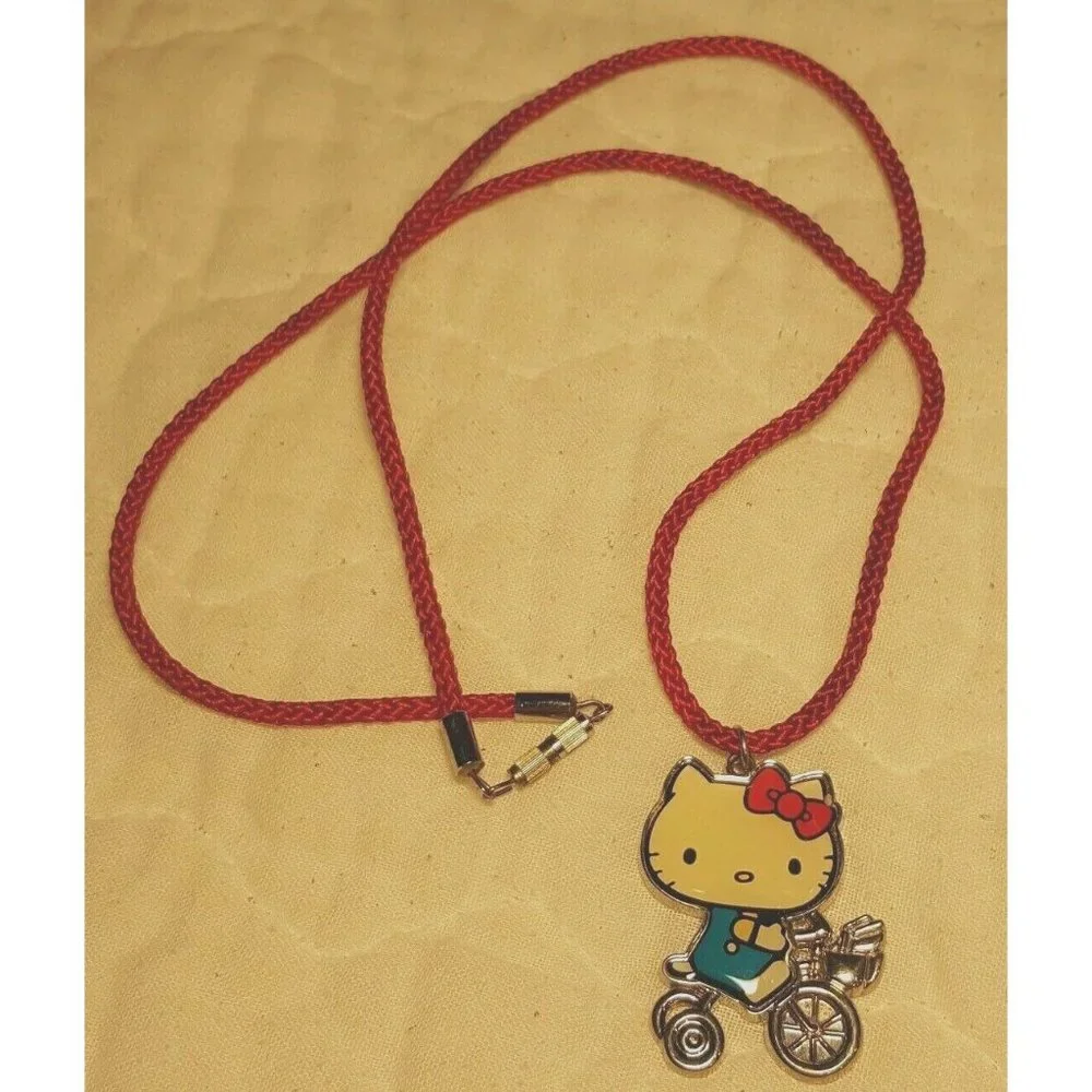 2010 Sanrio Hello Kitty Old School Bike Trike Necklace on Red Cord Appx 2